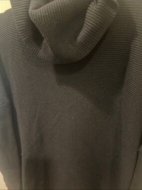 Woman’s  Black Ribbed Turtleneck Sweater